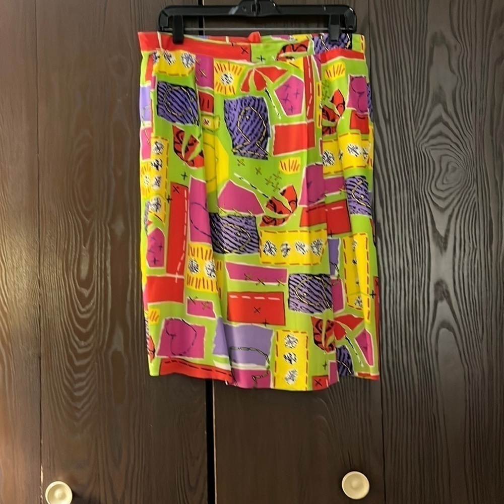 SK & Company silky, wild patterned skirt. Size 10. Fully lined and zipper back.
